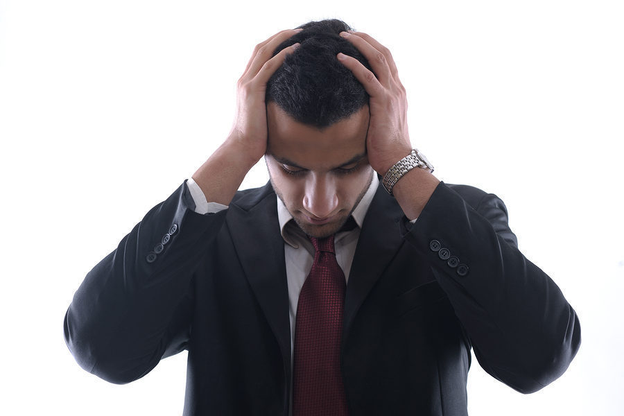 Stress and frustration at work. Image shows a black man who's ready for some help!